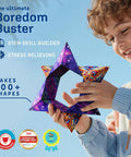 Child playing with Shape Shifting Puzzle Cube With Ultra Strong Magnets Transforms Into 100 Plus Shapes Award Winning Fidget Toy