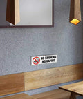 No Smoking No Vaping Sign Set Of 4, 9 By 3 Inch Stick On Wall Signs For Home Office Or Business, mounted on a wall in a modern room.