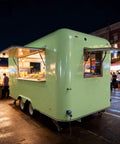Kickstart Your Food Truck Hustle With This Turnkey Mobile Kitchen Trailer Featuring Plug And Play Electrical And Nsf Stainless Steel Counters Perfect For Sliders Coffee And Quick Cash Flow, green trailer at night.