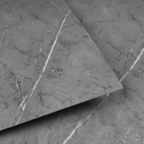 Close-up of gray marble look peel and stick floor tiles, self adhesive vinyl for bathroom or bedroom renovation, 12x12 inch size.