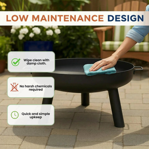 Person cleaning 27.5 Inch Outdoor Wood Burning Fire Pit With Handles And Cover Black Lightweight 17.5 Lb Portable Fire Pit