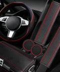 Upgrade Your Ride With This Six Piece Car Accessory Kit Packing A Slick Microfiber Steering Wheel Cover and red seat belt pads.