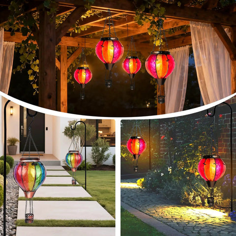 Two Pack Hot Air Balloon Solar Lanterns With Metal Shepherds Hook For Outdoor Pathway Lighting Garden Decor And Cozy Flickering Flame Glow That Charges By Day And Shines At Night displayed in garden setting