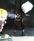 Under Deck Drainage System For 16 Inch Joists, 50 Ft Roll, 30 Mil Thick Trough Black Top being installed with drill