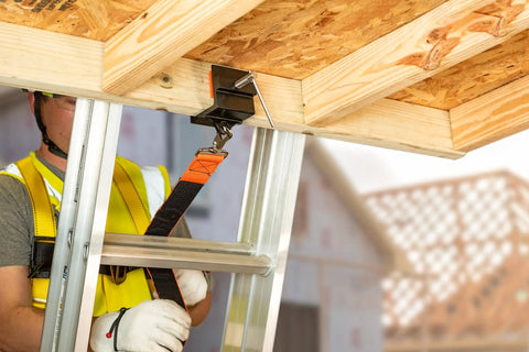 Ladder Stability Anchor for Easy No Drill Mounting with worker attaching to rafters using straps, lightweight aluminum construction