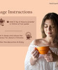 Woman holding cup with usage instructions for All Natural Arjuna Powder For Heart Health And Wellness, Terminalia Arjuna Bark Supplement