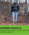 Man using Heavy Duty 80V Cordless Backpack Leaf Blower Featuring 750 Cfm Brushless Motor Paired With A 4 Point Zero Ah Battery and Charger in wooded area.