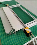 Hassle Free 125 Cm Acrylic Bender Heater Press For Curving Plastic Sheets Easily With Variable Temp Controls, water cooled rails on green cutting mat.
