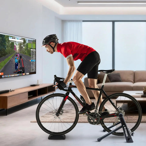 Cyclist using a Steel Bicycle Trainer Stand with Fluid Magnetic Resistance for Indoor Cycling, in a modern living room setup.