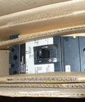 KAL36100 Three Pole Circuit Breaker Top Shelf Molded Case Thermal Magnetic Switch K Frame rated at 100 Amps inside cardboard packaging.