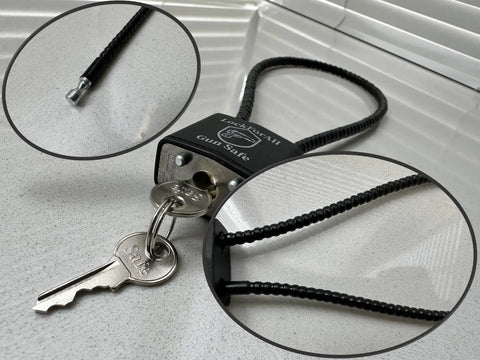 Close-up of Heavy Duty 15 Inch Cable Firearm Lock All Kept Alike Keys with steel cable and lock for secure storage.