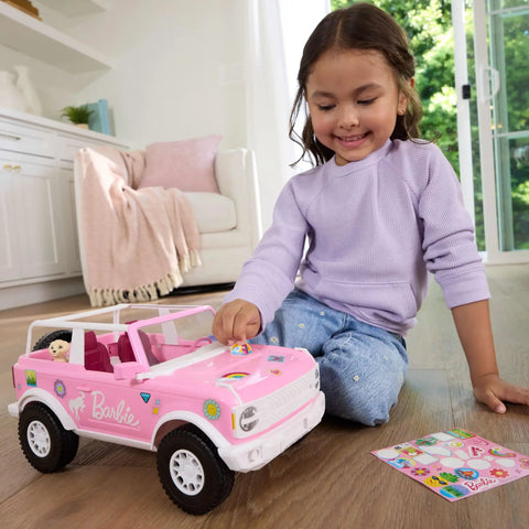 Child playing with Ford Bronco Remote Control RC Car for Barbie with Puppy Accessories, pink exterior, stickers visible.