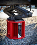 Magnetic RV Jack Stabilizer Blocks Four Pack positioned under RV jack on gravel surface for leveling trailers.