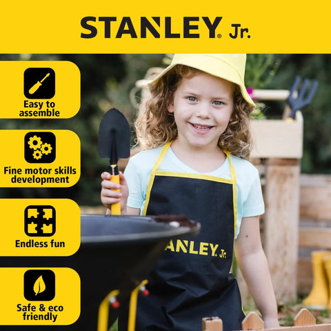 Six Piece Kid Friendly Wheelbarrow And Garden Tool Set With Apron And Gloves For Backyard Play, child holding spade
