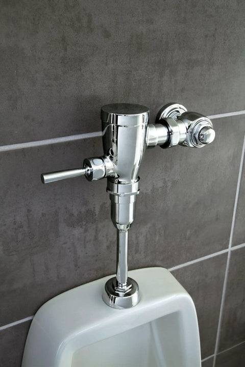 Commercial Three Quarter Inch Urinal Flush Valve With AccuSet Piston, Rock Solid Brass Construction installed on wall above urinal