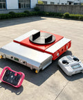 Heavy Lifter Electric Transfer Cart With Rotating Turntable And Wireless Remote Control on concrete surface with remotes.