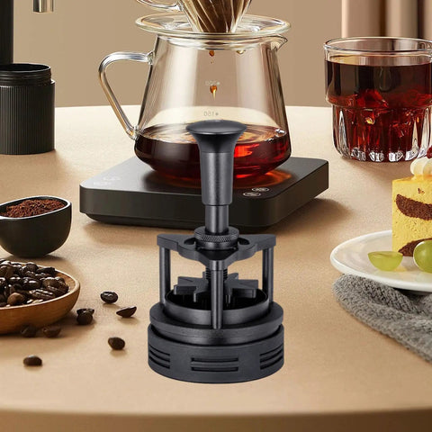 Killer Rotatable Espresso Coffee Distributor Stirrer Featuring Adjustable Height And Durable Aluminum Alloy Build on a counter next to coffee.