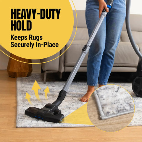 Vacuum on rug secured by No Slip Double Sided Rug Tape 2 Inch By 30 Yard For Securing Area Rugs On Carpet Hardwood And Laminate Floors