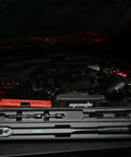 Beefy 1/2-Inch Drive Click Torque Wrench With 25-250 Ft-Lb Range in case, shown in automotive maintenance setting.