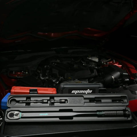 Beefy 1/2-Inch Drive Click Torque Wrench With 25-250 Ft-Lb Range in case, shown in automotive maintenance setting.