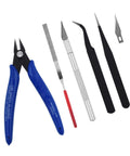 Front view: 7-piece plastic model tool set with blue nippers, file, knife, curved and straight tweezers, spare blade.