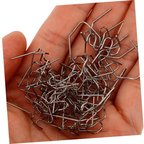 Hand holding silver staples from 600Pcs Car Repair Welding Staples Kit Assorted For Bumper Repair Easy To Use Welding Staples For Quick Crack Fix Enhanced Efficiency For Auto Repair Professionals.