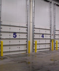 Straight Up Heavy Duty Yellow Bollard Post Cover 48 Inch Height By 6.5 Diameter Low Density Polyethylene Thermoplastic Guard protecting loading dock.