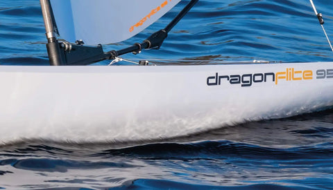 Side view of Dragonflite 95 RC Sailboat Ready to Run 950mm RTR White Hull With Durable Polycarbonate Construction on water.