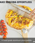 Front view of OVTHMT aluminum pizza peel with wooden handle, 12x14 in, lifting a cheese pizza.