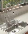 Drop In Single Bowl Stainless Steel Kitchen Sink 25 By 22 Inches 1 Hole 20 Gauge Durable EZ Torque Fastener System For Easy Lock In Install And Built To Take On Messy Kitchen Days installed on a countertop with modern faucet and window view.
