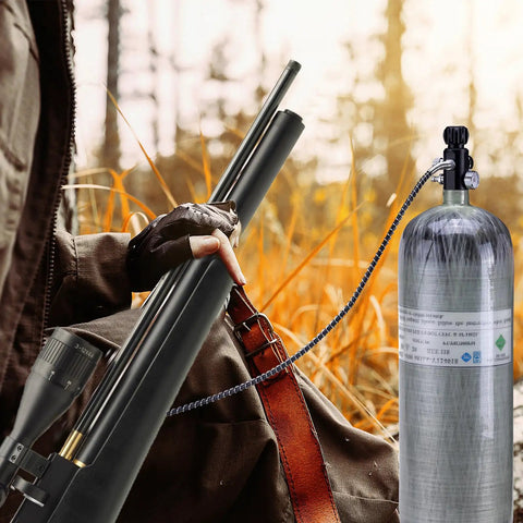 Person using Dual Gauge Paintball Fill Station Valve With 7/8-14UNF Thread 4500 Psi High Pressure Tank Charging System 20 Inch Non Regulated Hose PCP Air Gun Air Tank Valve in outdoor setting