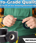Black electrical tape rolls; Phyxology brand, several rolls stacked with one being held