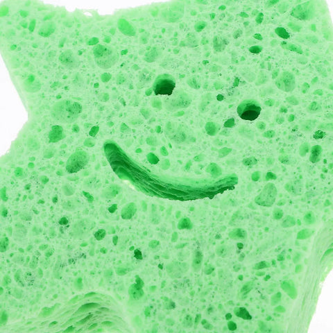 Green star shaped body scrubber sponge with quick drying wear resistant material for deep cleaning bathing home and travel use.