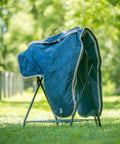 Western Padded Saddle Carrier With Water Resistant 420D Nylon, Turquoise Polka Dots Saddle Bag displayed on a stand outdoors