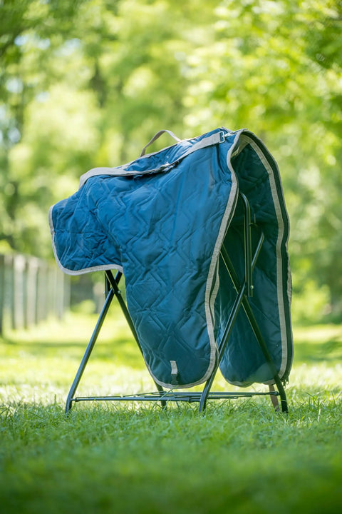 Western Padded Saddle Carrier With Water Resistant 420D Nylon, Turquoise Polka Dots Saddle Bag displayed on a stand outdoors