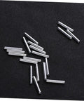 Silver metal pieces from 120pcs Robot Drive Shaft Kit For DIY Projects, Transmission Shafts And RC Car Axle Gears, on black background