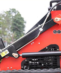 Side view of Stomp Mini Skid Steer Loader with 1800 lb capacity and lawn scarifier attachment for small jobs and landscaping.