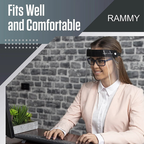 Person wearing Clear Full Face Shield Mask Pack Of 2 Anti Fog Protective Shield for eyes, nose, and face at office desk.