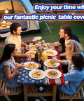Group dining outdoors with picnic table cover in American flag design, fitted tablecloth with elastic edges, 72 by 30 in, tailgate ready.