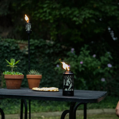 Hunter Metal 64.5 Inch Torch Two Pack For Patio Backyard Lawn Decor Black Finish With Easy Installation on a table