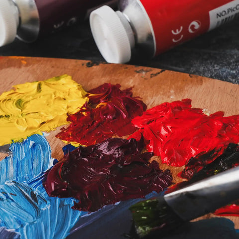 Raw Sienna Oil Paint Pro Grade Studio Tube 170ml with High Pigment Thick Creamy Texture on artist palette with mixed colors