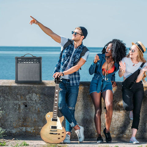People outdoors with 20 Watt Portable Electric Guitar Amplifier With Headphone Input And Gain Control for Quiet Practice or Onstage Jams
