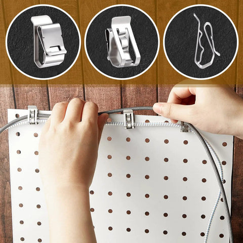 Hands installing Heavy Duty Stainless Steel Solar Wire Clips For Outdoor Setup And Yard Work Fits 0.2 To 0.3 Inch Cable on pegboard.