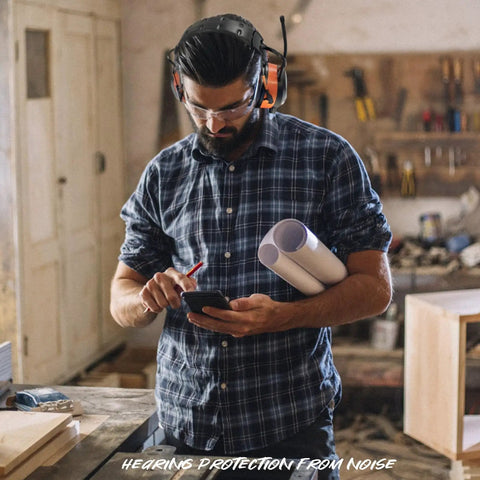 Man wearing Safety Bluetooth Earmuffs For Mowing And Power Tools With FM Radio NRR 29dB in workshop