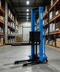 Heavy Duty Electric Portable Forklift Pallet Jack That Slides Heavy Loads Smoothly For Warehouse Stacking, Loading, Unloading And Daily Cargo Hauling In Factories Or Logistics Centers Like A Total Boss Machine in a warehouse aisle.