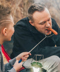 Father and son using 45 Inch Extra Long Marshmallow Roasting Sticks Kit For Campfire Smores, 4 Pack Telescoping Skewers.