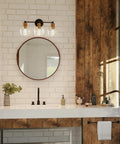 Coastal 3 Light Bath Vanity Light With Clear Glass Globes In Antique Bronze Finish installed above bathroom mirror