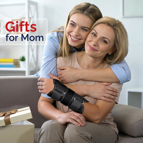 Mother wearing Wrist Brace For Carpal Tunnel And Night Time Pain Relief With Splints, hugged by daughter, gift box nearby.