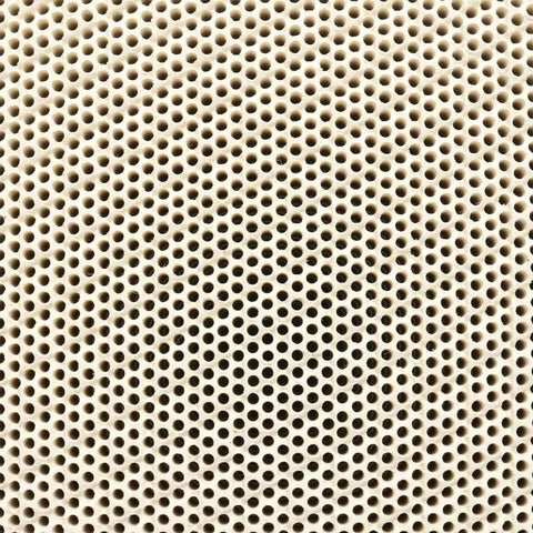 Close-up of the honeycomb ceramic surface of the Soldering Board for Jewelry Making, 135x95x13mm, flame and acid resistant