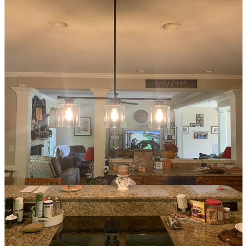 Dope Three Light Modern Industrial Farmhouse Kitchen Island Pendant Lighting with clear glass shades over kitchen counter